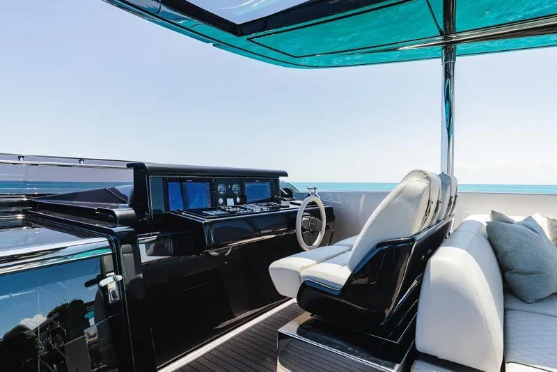 Slide: The Image of Luxurious 2022 Riva 90' Argo yacht cockpit with sleek design and ocean view. - 40