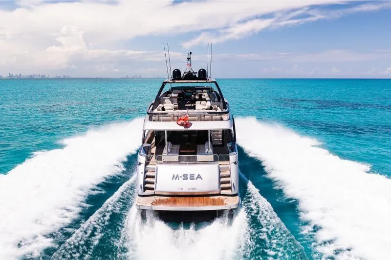 Slide: The Image of Luxury Riva 90' Argo yacht cruising on turquoise waters, 2022 model. - 56