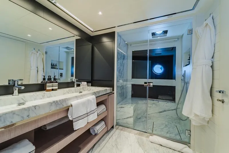 Slide: The Image of Luxurious bathroom on 2022 Riva 90' Argo yacht with marble finishes and modern amenities. - 19