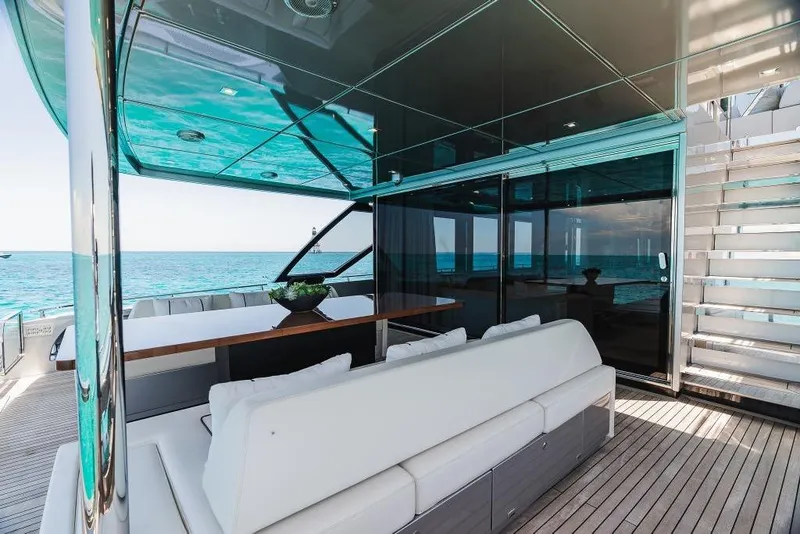 Slide: The Image of Luxurious 2022 Riva 90' Argo yacht interior with ocean view and modern seating area. - 11