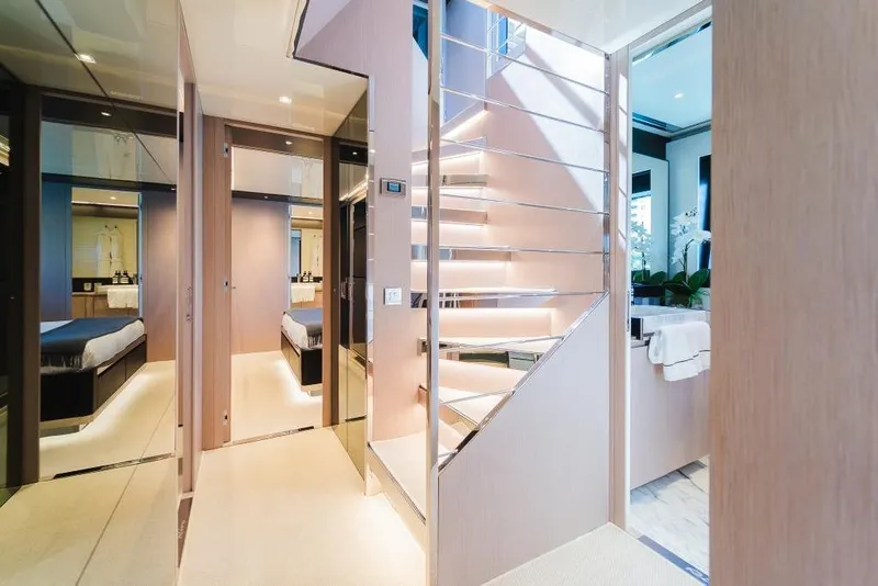 Slide: The Image of Luxurious interior of 2022 Riva 90' Argo yacht featuring modern staircase and elegant design. - 21