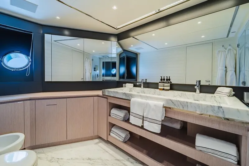 Slide: The Image of Luxurious bathroom on 2022 Riva 90' Argo yacht with marble countertops and elegant fixtures. - 20