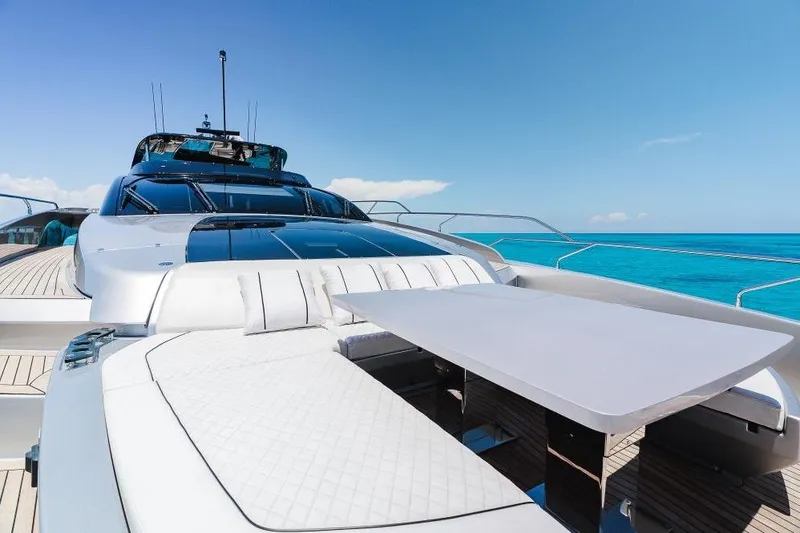 Slide: The Image of Luxurious 2022 Riva 90' Argo yacht with sleek design and ocean backdrop. - 48