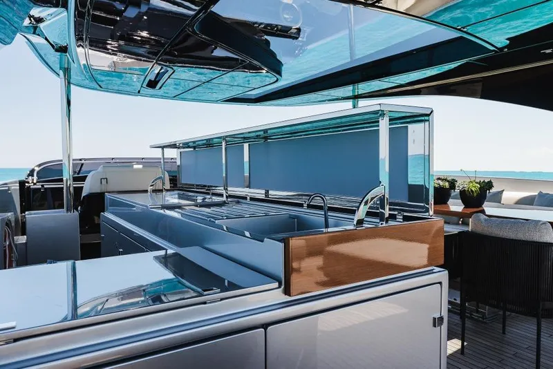 Slide: The Image of Luxurious 2022 Riva 90' Argo yacht interior with sleek kitchen and ocean view. - 42