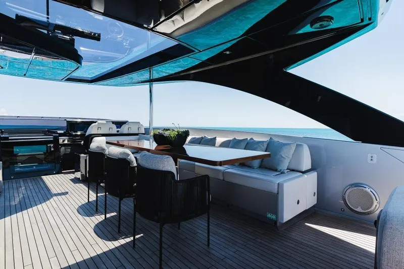 Slide: The Image of Luxurious deck of 2022 Riva 90' Argo yacht with elegant seating and ocean view. - 34