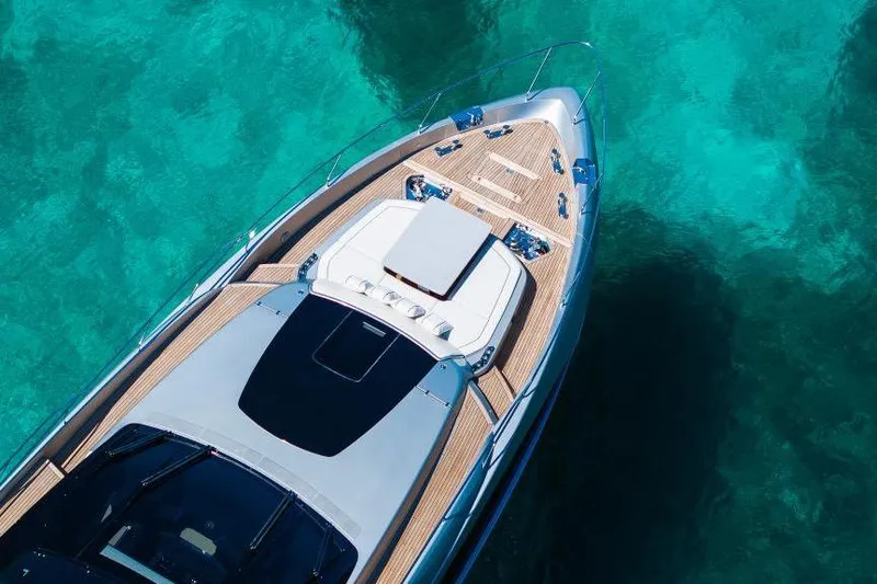Slide: The Image of Aerial view of 2022 Riva 90' Argo yacht on turquoise water. - 53