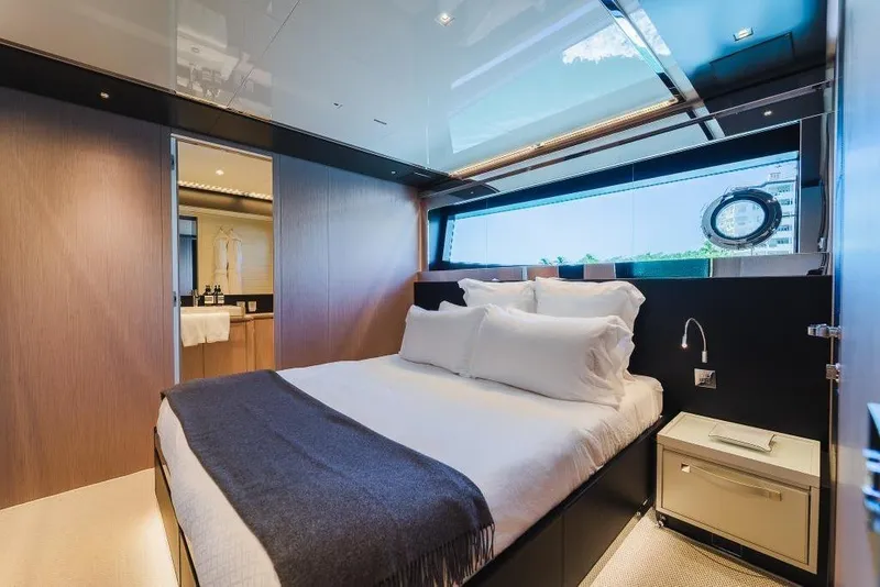 Slide: The Image of Luxurious bedroom interior on 2022 Riva 90' Argo yacht, featuring elegant design and modern amenities. - 22