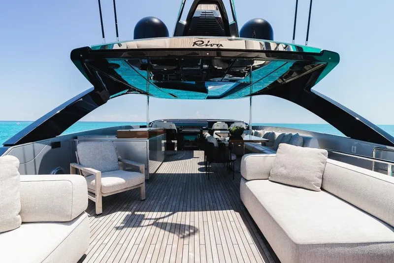 Slide: The Image of Luxurious 2022 Riva 90' Argo yacht deck with elegant seating and ocean view. - 35