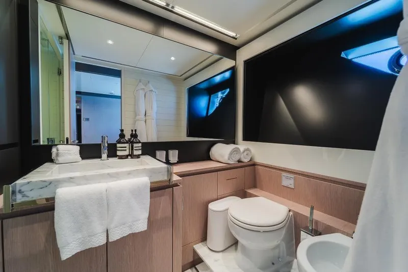 Slide: The Image of Luxurious bathroom interior on 2022 Riva 90' Argo yacht, featuring modern fixtures and elegant design. - 23