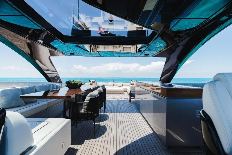 Slide: The Image of Luxurious 2022 Riva 90' Argo yacht interior with ocean view and elegant seating. - 32