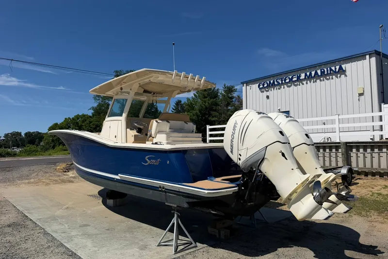 Slide: The Image of 2019 Scout 300 LXF boat with dual Mercury engines at Comstock Marina. - 5