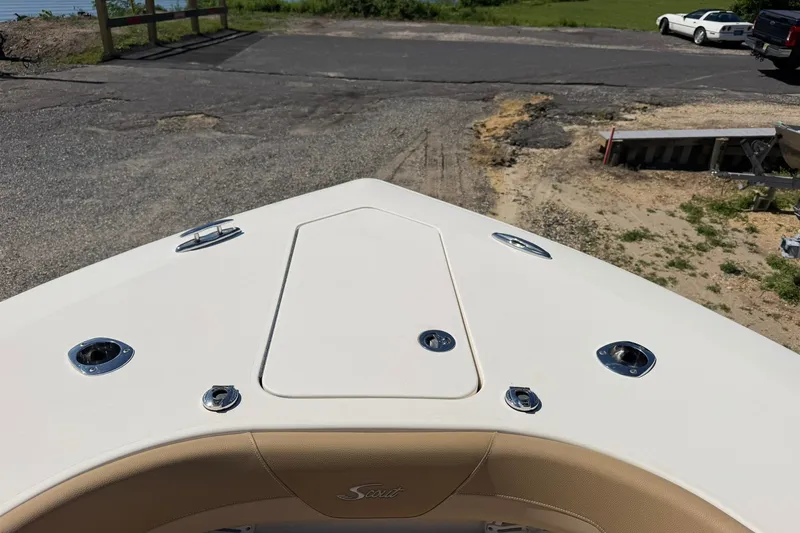 Slide: The Image of Bow view of 2019 Scout 300 LXF boat at a launch ramp. - 24