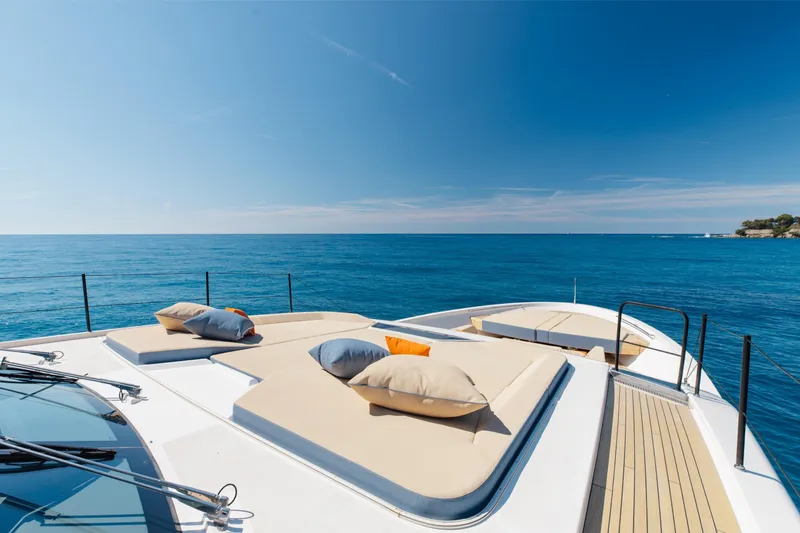 Slide: The Image of Luxurious 2022 Sanlorenzo SL106A yacht deck with sun loungers and ocean view. - 37