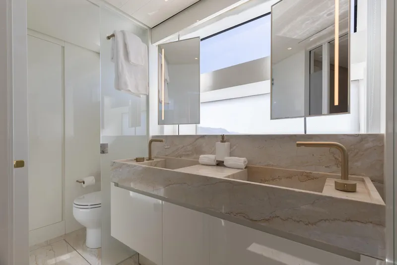 Slide: The Image of Luxurious bathroom on 2022 Sanlorenzo SL106A yacht with marble sink and modern fixtures. - 14