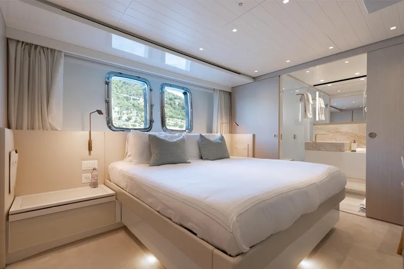 Slide: The Image of Luxurious bedroom interior on 2022 Sanlorenzo SL106A yacht, featuring elegant design and natural light. - 17