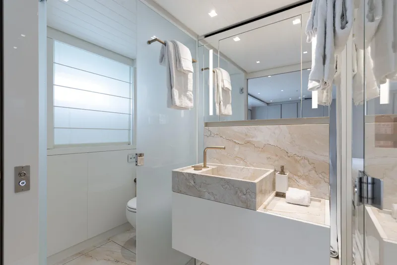 Slide: The Image of Luxurious bathroom on 2022 Sanlorenzo SL106A yacht with marble sink and modern fixtures. - 19