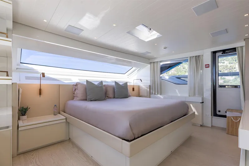Slide: The Image of Luxurious bedroom interior of 2022 Sanlorenzo SL106A yacht with modern design and large windows. - 13