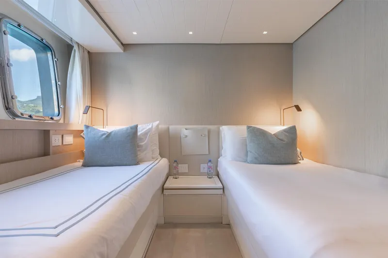 Slide: The Image of Luxurious twin cabin on 2022 Sanlorenzo SL106A yacht, featuring modern design and ocean view. - 22