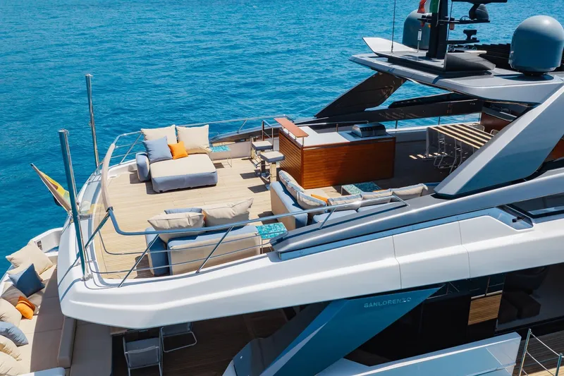 Slide: The Image of Luxurious 2022 Sanlorenzo SL106A yacht with spacious deck and elegant seating on blue ocean. - 42
