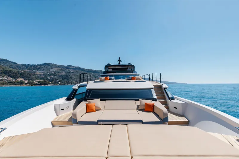 Slide: The Image of Luxurious 2022 Sanlorenzo SL106A yacht with sun loungers, cruising on a clear blue sea. - 36