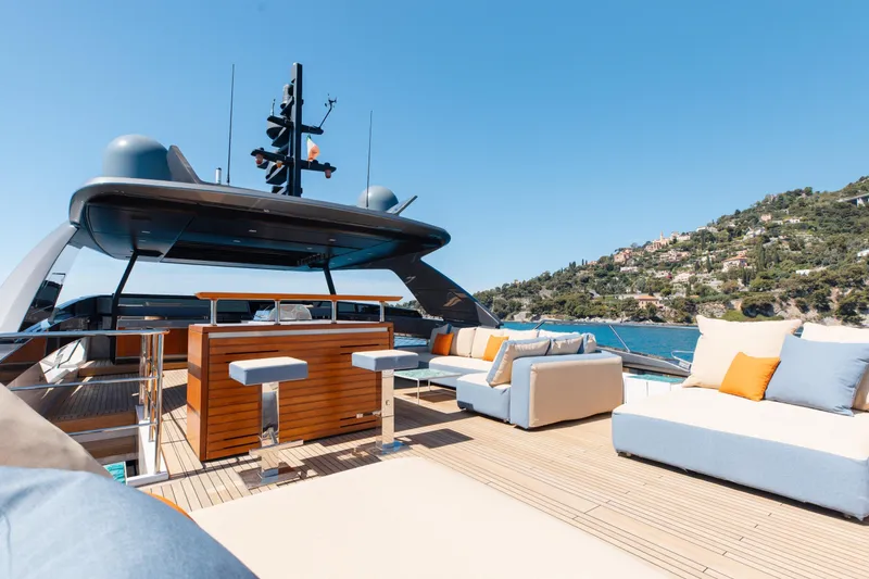Slide: The Image of Luxurious 2022 Sanlorenzo SL106A yacht deck with modern seating and scenic coastal view. - 30