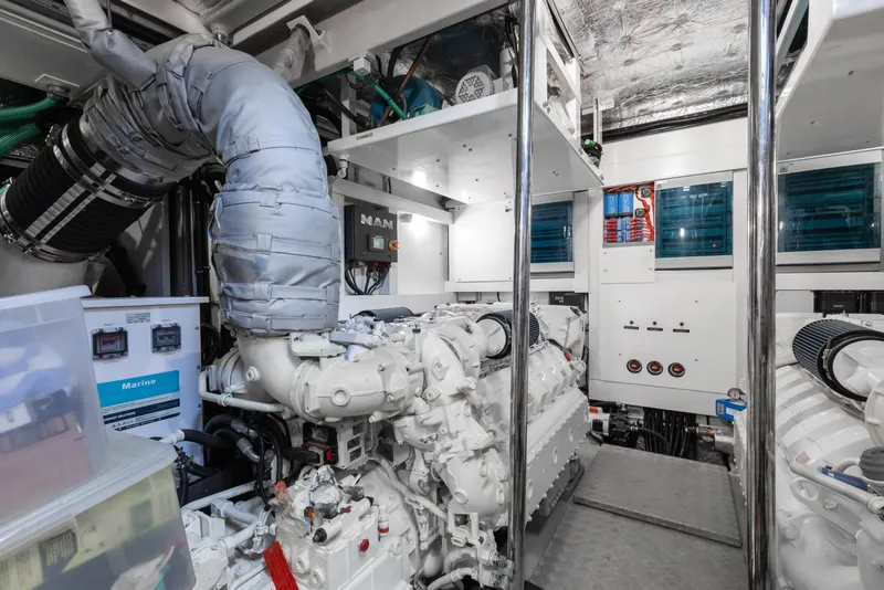 Slide: The Image of Engine room of a 2022 Sunseeker 76 Yacht, featuring advanced machinery and equipment. - 91