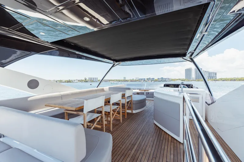 Slide: The Image of Luxurious 2022 Sunseeker 76 Yacht deck with seating and ocean view. - 76