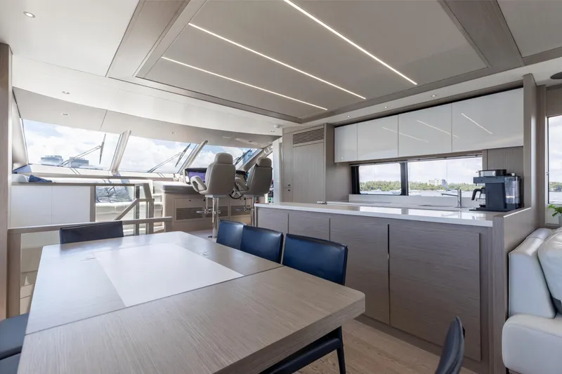 Slide: The Image of Luxurious interior of 2022 Sunseeker 76 Yacht with modern dining and helm area. - 37