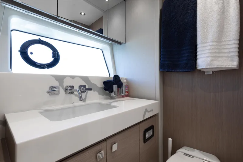 Slide: The Image of Luxurious bathroom interior of 2022 Sunseeker 76 Yacht with modern fixtures and towels. - 63