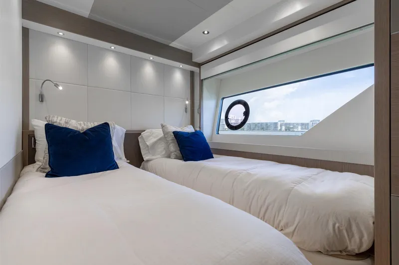 Slide: The Image of Luxurious twin bedroom on 2022 Sunseeker 76 Yacht with ocean view window. - 61