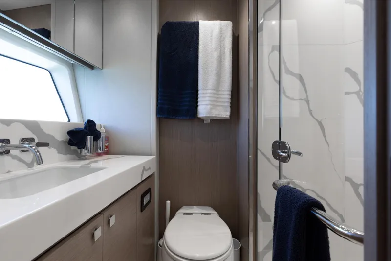 Slide: The Image of Luxurious bathroom on 2022 Sunseeker 76 Yacht with modern fixtures and elegant design. - 64