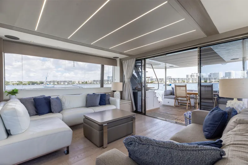 Slide: The Image of Luxurious interior of 2022 Sunseeker 76 Yacht with waterfront view and elegant furnishings. - 33