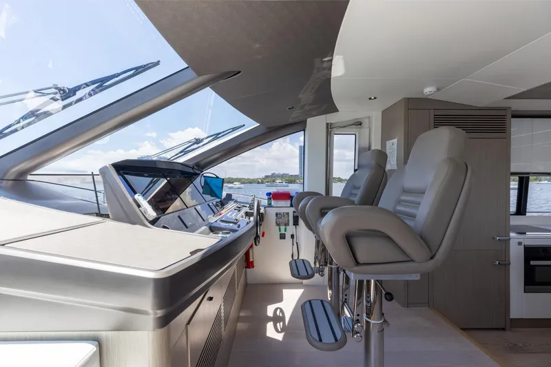 Slide: The Image of Luxurious Sunseeker 76 Yacht 2022 helm with modern controls and plush seating. - 65