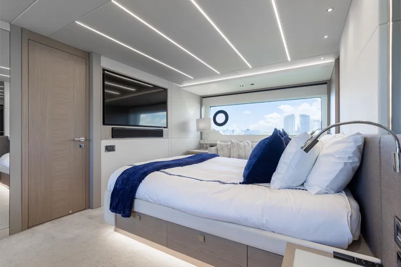 Slide: The Image of Luxurious bedroom interior of 2022 Sunseeker 76 Yacht with modern design and large window view. - 45