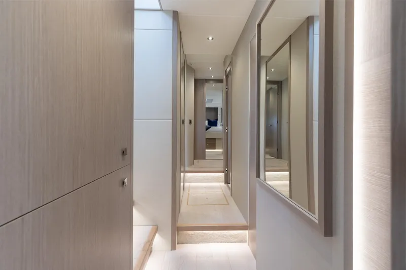 Slide: The Image of Luxurious interior hallway of 2022 Sunseeker 76 Yacht, featuring modern design and elegant lighting. - 50