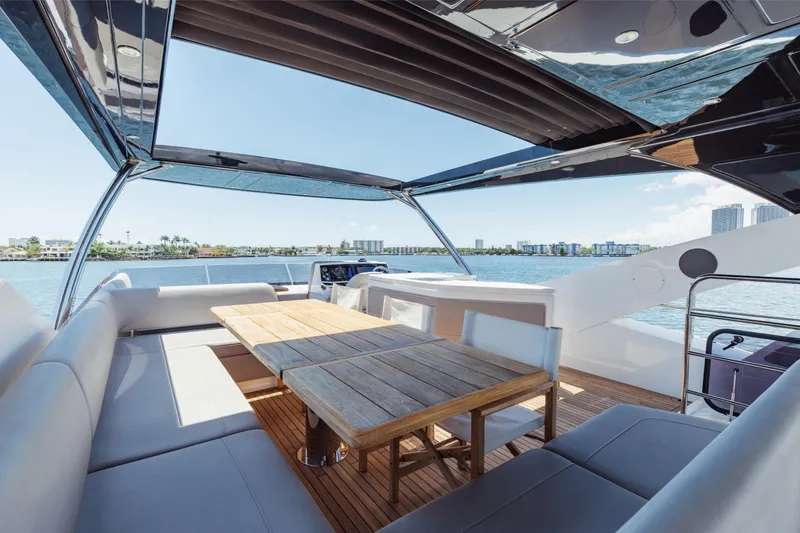 Slide: The Image of Luxurious Sunseeker 76 Yacht 2022 with spacious deck and scenic waterfront view. - 74