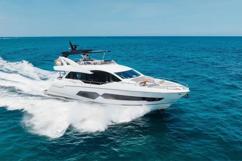 Slide: The Image of 2022 Sunseeker 76 Yacht cruising on open blue ocean waters. - 20