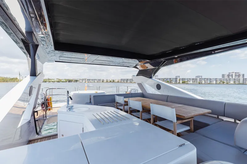 Slide: The Image of Luxurious Sunseeker 76 Yacht 2022 with spacious deck and elegant seating area. - 75
