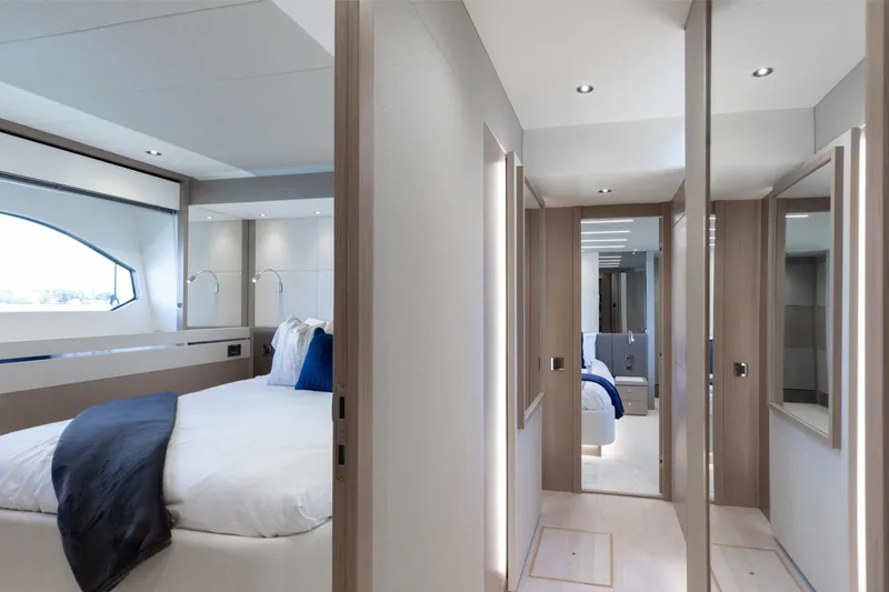 Slide: The Image of Luxurious bedroom interior of 2022 Sunseeker 76 Yacht, featuring modern design and elegant furnishings. - 59