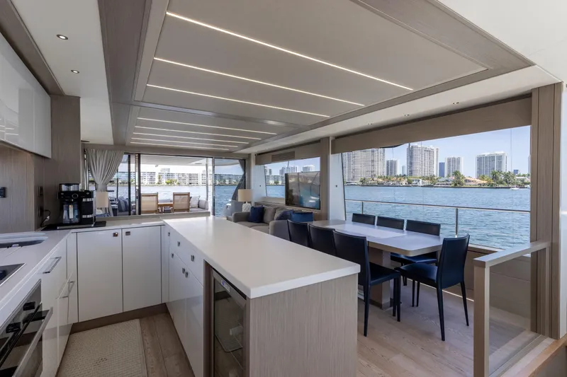 Slide: The Image of Luxurious interior of 2022 Sunseeker 76 Yacht with modern kitchen and dining area. - 41
