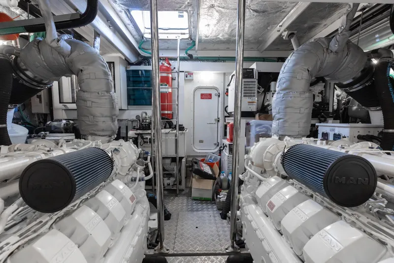 Slide: The Image of Engine room of a 2022 Sunseeker 76 Yacht, featuring dual MAN engines and advanced equipment. - 93