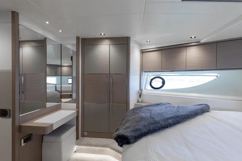 Slide: The Image of Luxurious interior of 2022 Sunseeker 76 Yacht bedroom with modern design and elegant furnishings. - 57