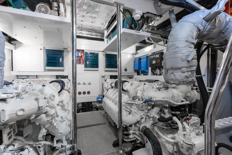 Slide: The Image of Engine room of 2022 Sunseeker 76 Yacht, featuring advanced machinery and equipment. - 90