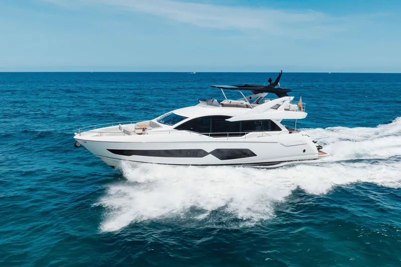 Slide: The Image of Luxurious 2022 Sunseeker 76 Yacht cruising on open blue sea. - 25