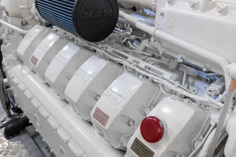 Slide: The Image of Engine room of 2022 Sunseeker 76 Yacht featuring a MAN engine. - 92