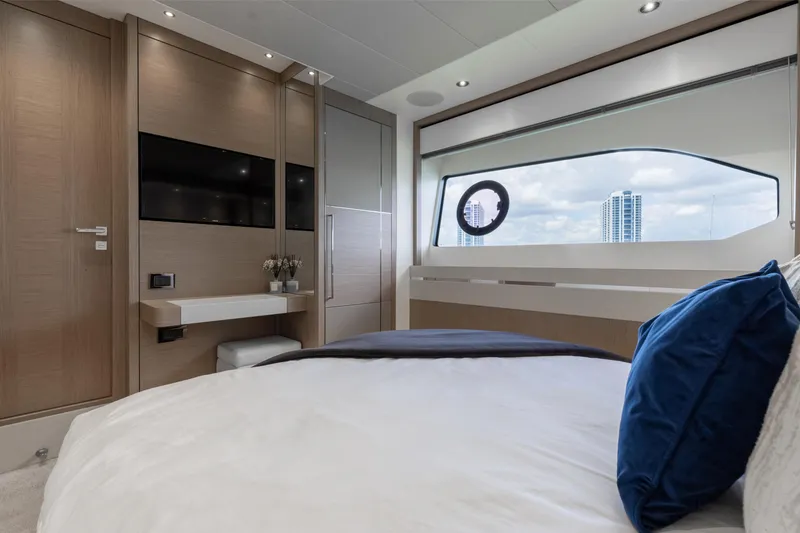 Slide: The Image of Luxurious Sunseeker 76 Yacht 2022 bedroom with modern decor and large window view. - 53