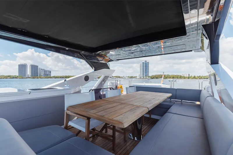 Slide: The Image of Luxurious Sunseeker 76 Yacht 2022 with spacious outdoor seating and scenic waterfront view. - 68