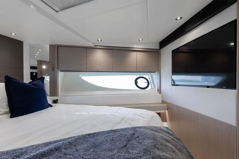 Slide: The Image of Luxurious bedroom interior of 2022 Sunseeker 76 Yacht with modern design and large window. - 56