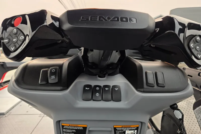 Slide: The Image of 2024 Seadoo Switch Sport dashboard with control buttons and steering wheel. - 11