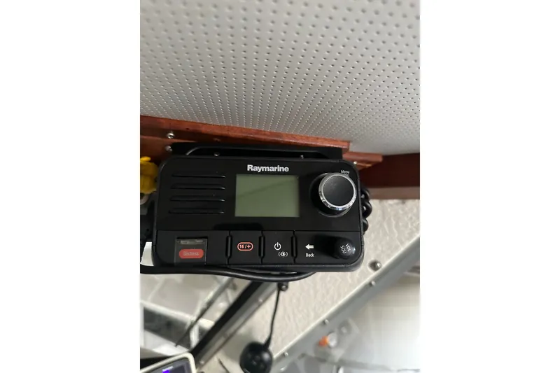 Slide: The Image of Raymarine marine radio installed on a 1999 Skagit Orca 24 boat ceiling. - 24